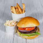 A TK flame-grilled beef burger with fries and coleslaw