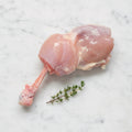 Raw chicken steak on a white marble surface