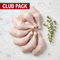 Club Pack of raw bone-in chicken legs, thigh and drumstick attached, with thyme on white marble