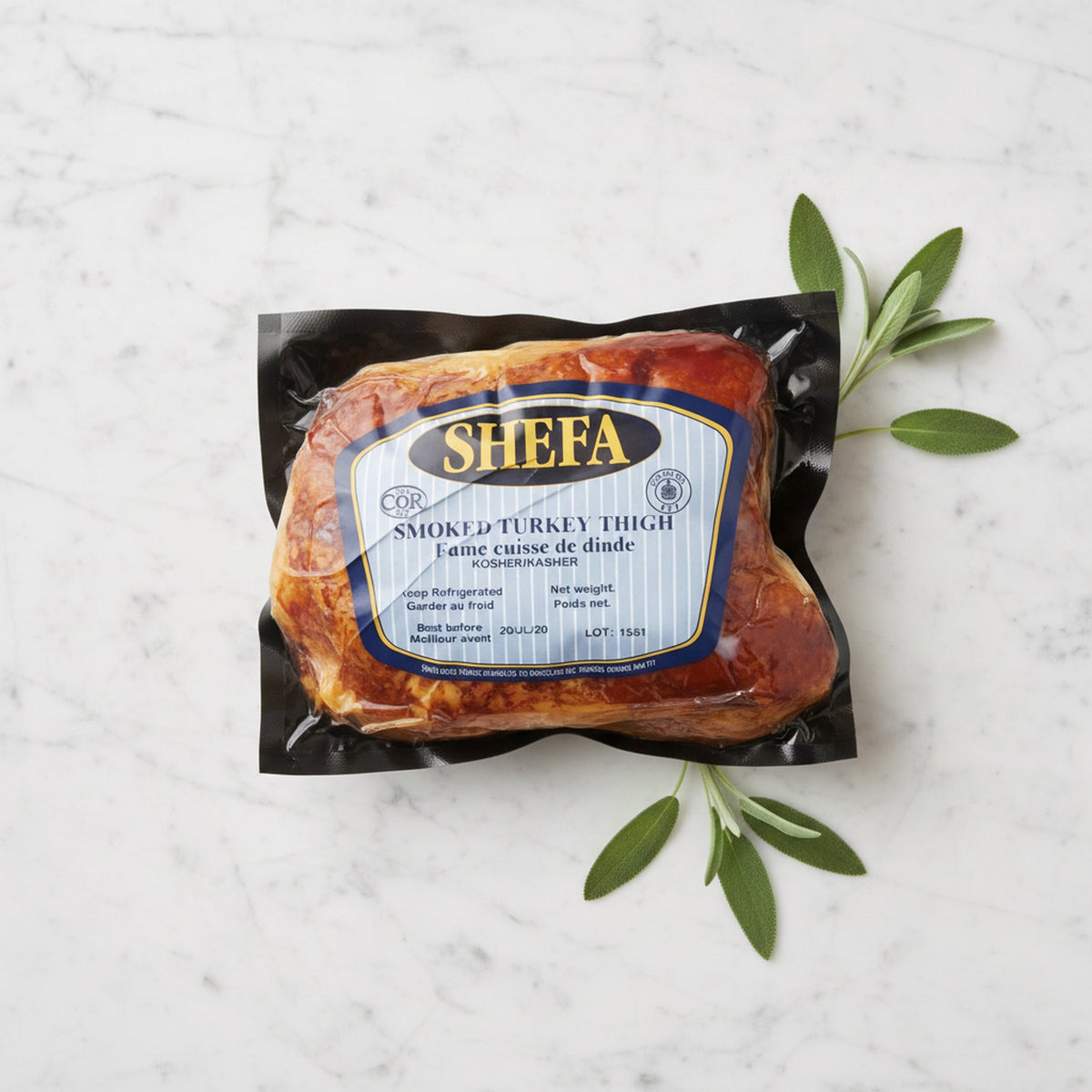 A packaged Shefa Smoked Turkey Thigh with sage leaves on a marble surface